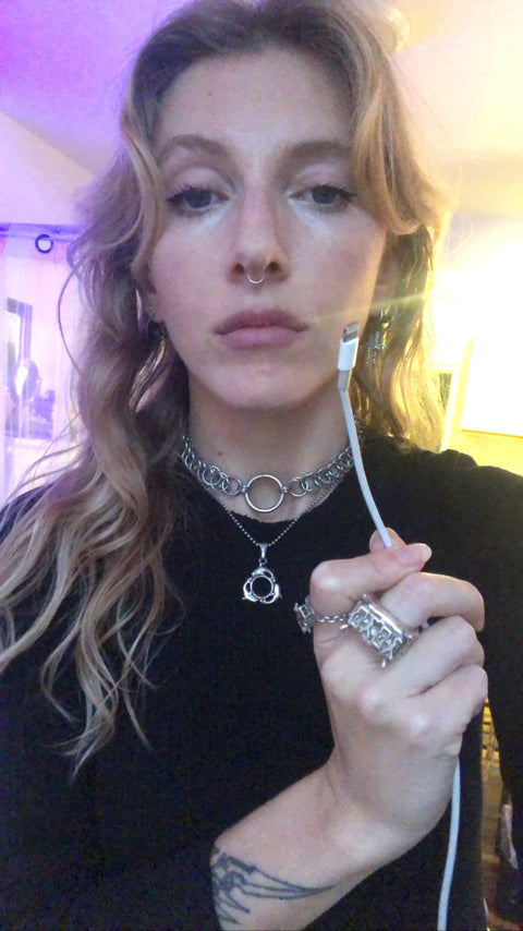 Tarot charm necklace featuring a 3D ring of dolphins for a modern interpretation of the Wheel of Fortune major arcana
