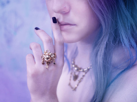 brass crystal ball ring with dangling stars as seen as free people